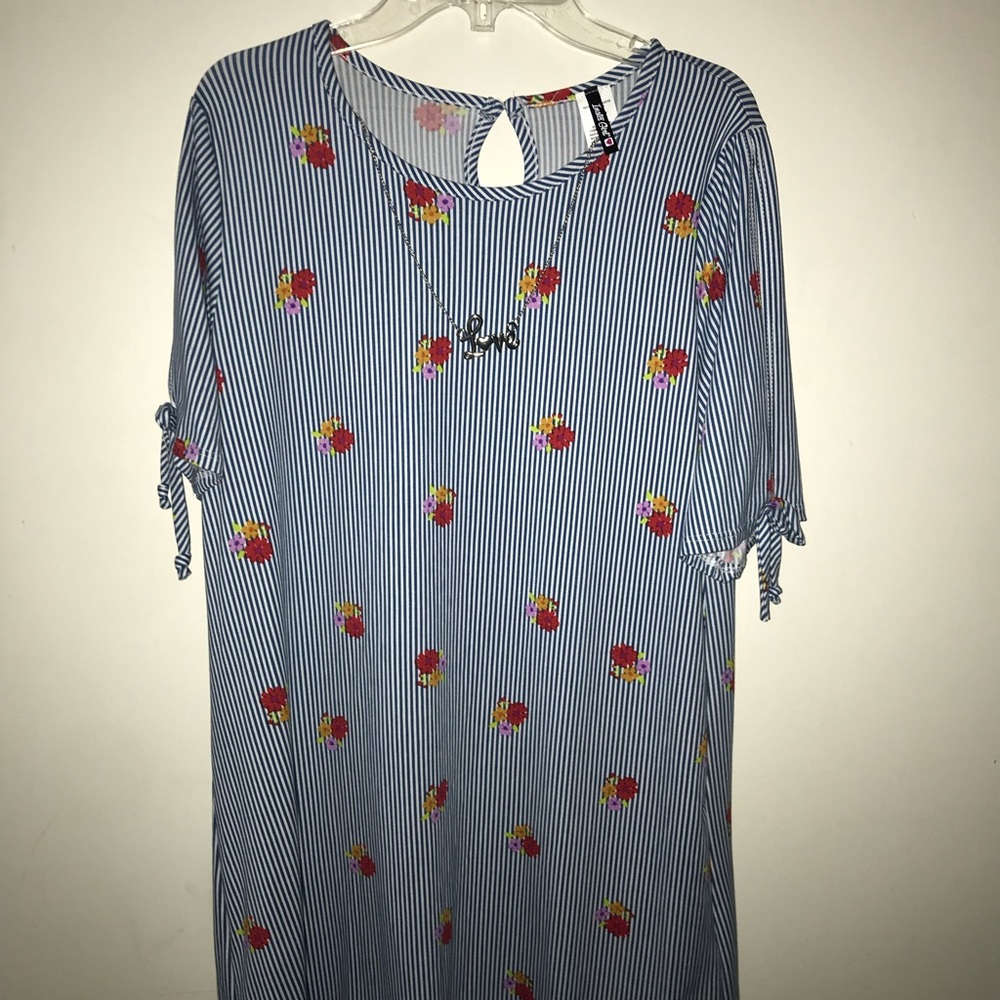 Blue and White Dress with a Necklace